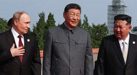 China unveils new weapons in parade attended by Putin, Kim